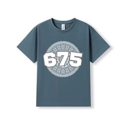 A slate blue crewneck t-shirt with a large white and grey graphic on the chest featuring the number 675