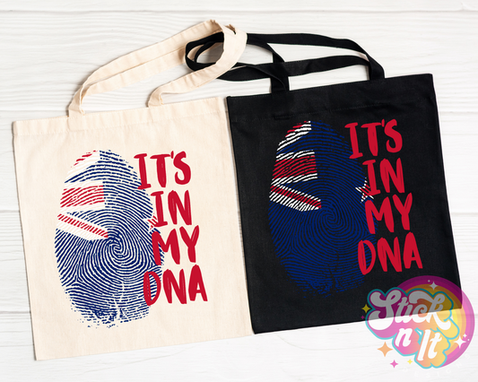 Tote bags featuring quote It's in my DNA with fingerprint shaped Aotearoa flag. 