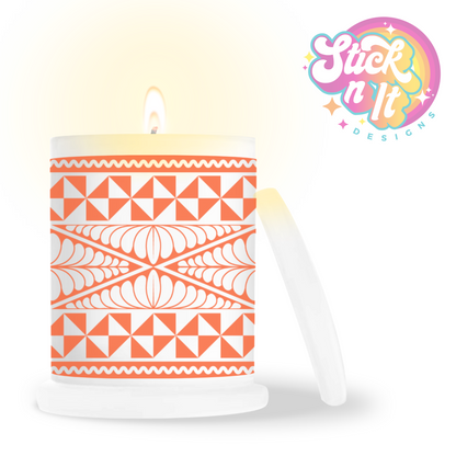 Frosted candle jar featuring a Polynesian Tongan design in orange