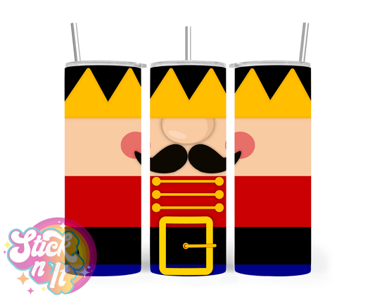 Stainless steel insulated tumbler featuring a Christmas drummer man