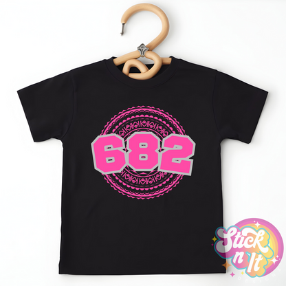 Kids size black shirt featuring a Polynesian Cook Islands design with area code 682 in pink.