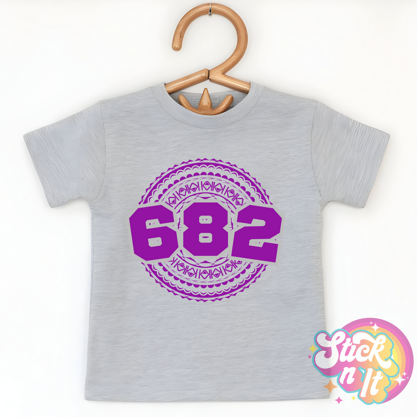 Kids size grey shirt featuring a Polynesian Cook Islands design with area code 682 in purple.