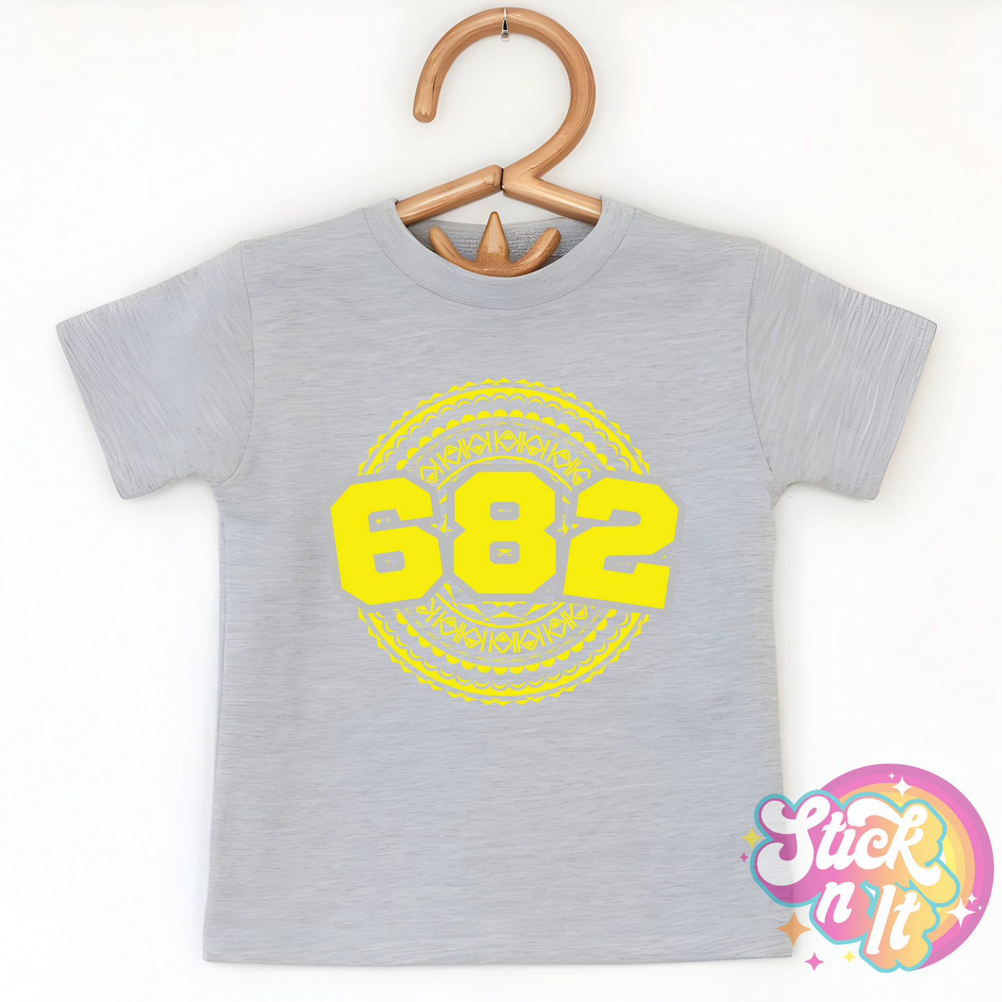 Kids size grey shirt featuring a Polynesian Cook Islands design with area code 682 in yellow.