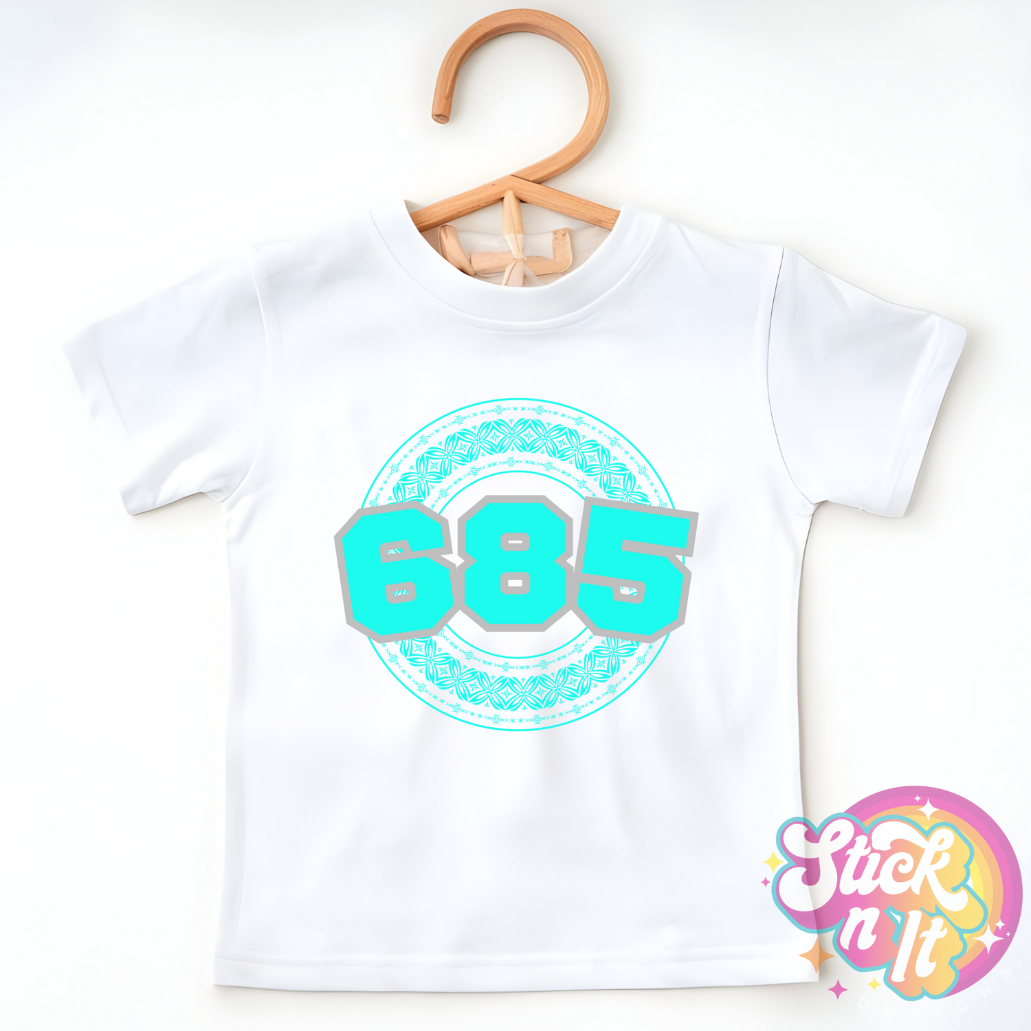 Kids size white shirt featuring a Polynesian Samoa design with area code 685 in aqua.