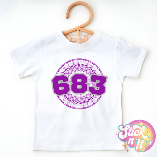 Kids size white shirt featuring a Polynesian Niue design with area code 683 in purple.