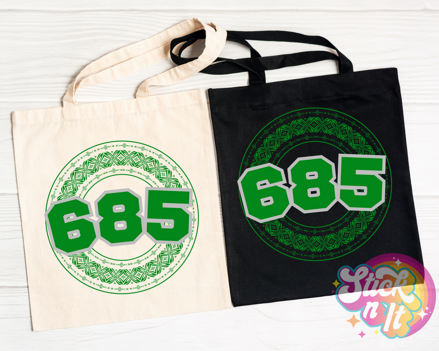 Black and natural coloured tote bags featuring a Polynesian Samoa design and area code 685 in green.