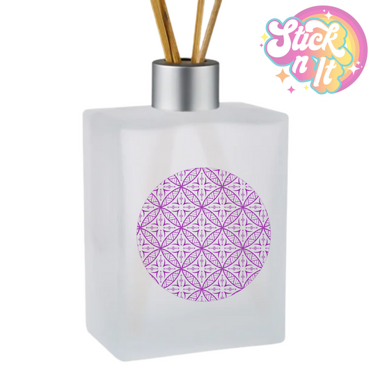 Rectangle glass reed diffuser with reed sticks featuring a Polynesian Samoan design in purple.
