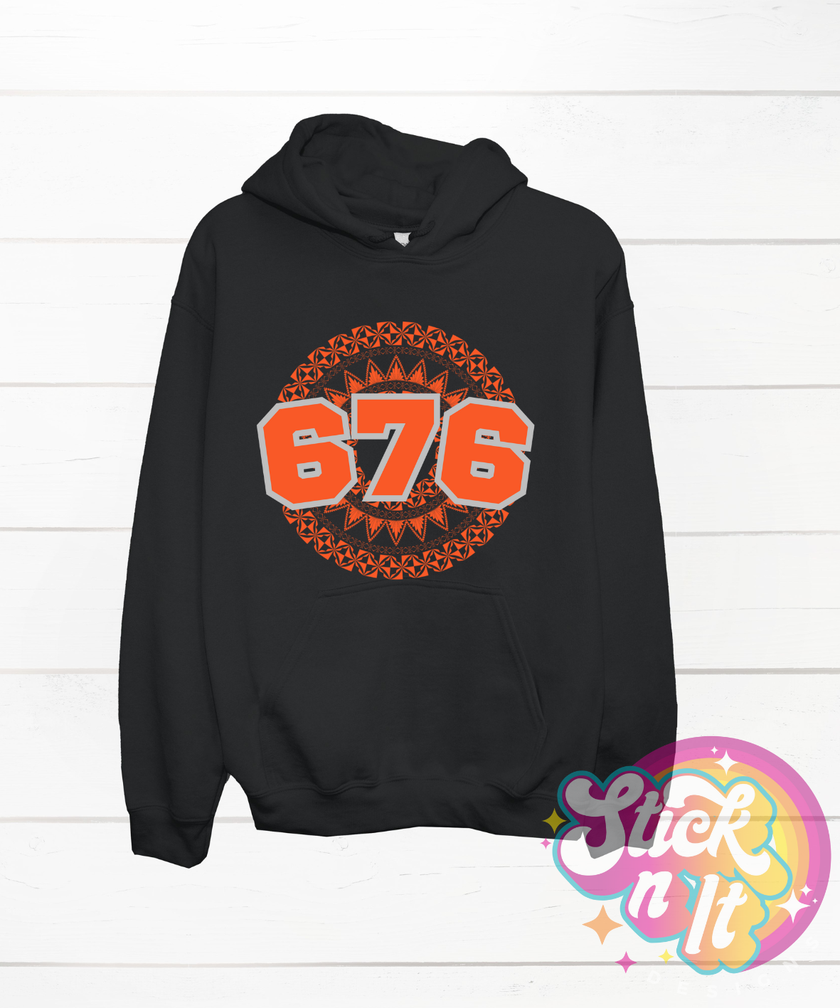 Unisex black hoodie featuring a Polynesian Tonga design with area code 676 in orange
