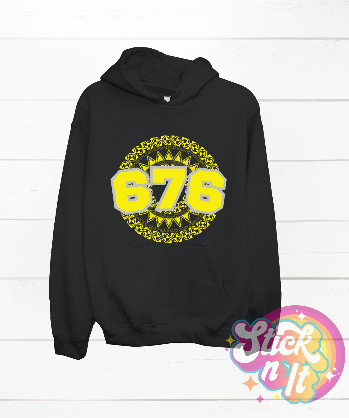 Unisex black hoodie featuring a Polynesian Tonga design with area code 676 in yellow