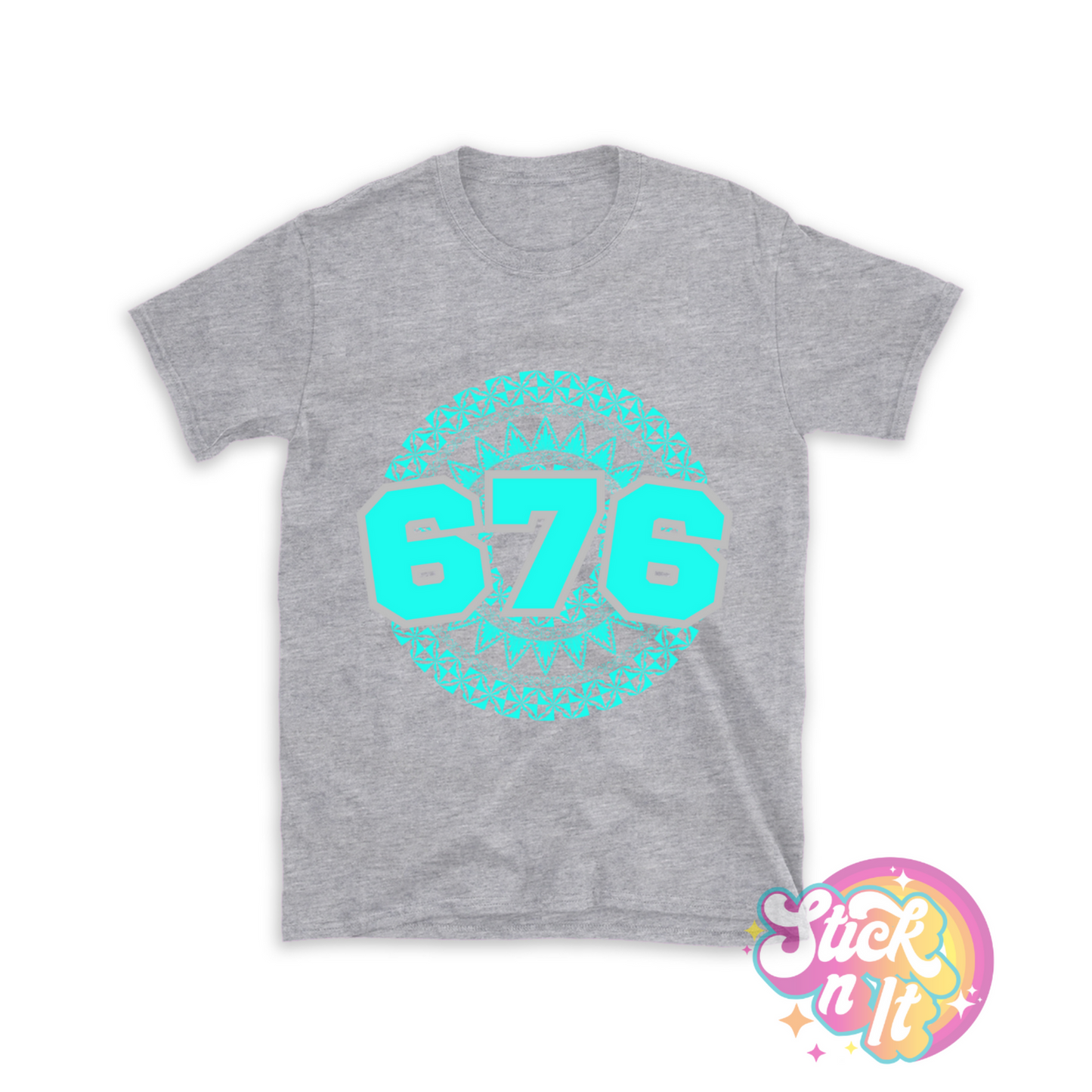 Unisex grey shirt featuring a Polynesian Tonga design with area code 676 in aqua