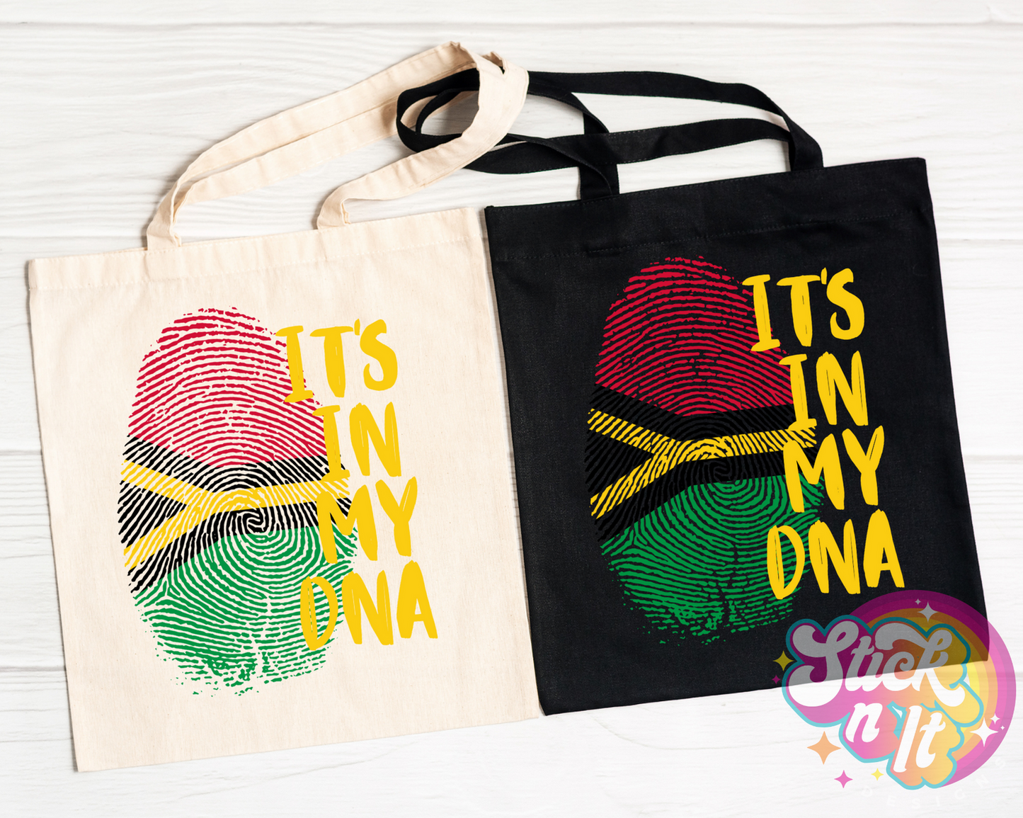 Black and natural colour tote bags featuring quote It's in my DNA in yellow with a fingerprint shaped Vanuatu flag